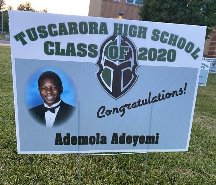 A lawn sign: Tuscarora High School Class of 2020, Congratulations, Ademola Adeyemi, with his senior photo