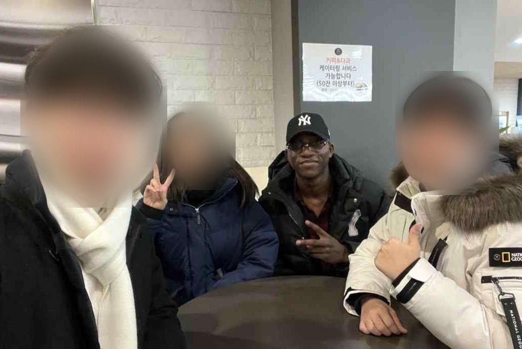 Ademola with his research team at Yonsei, his teammates' faces blurred